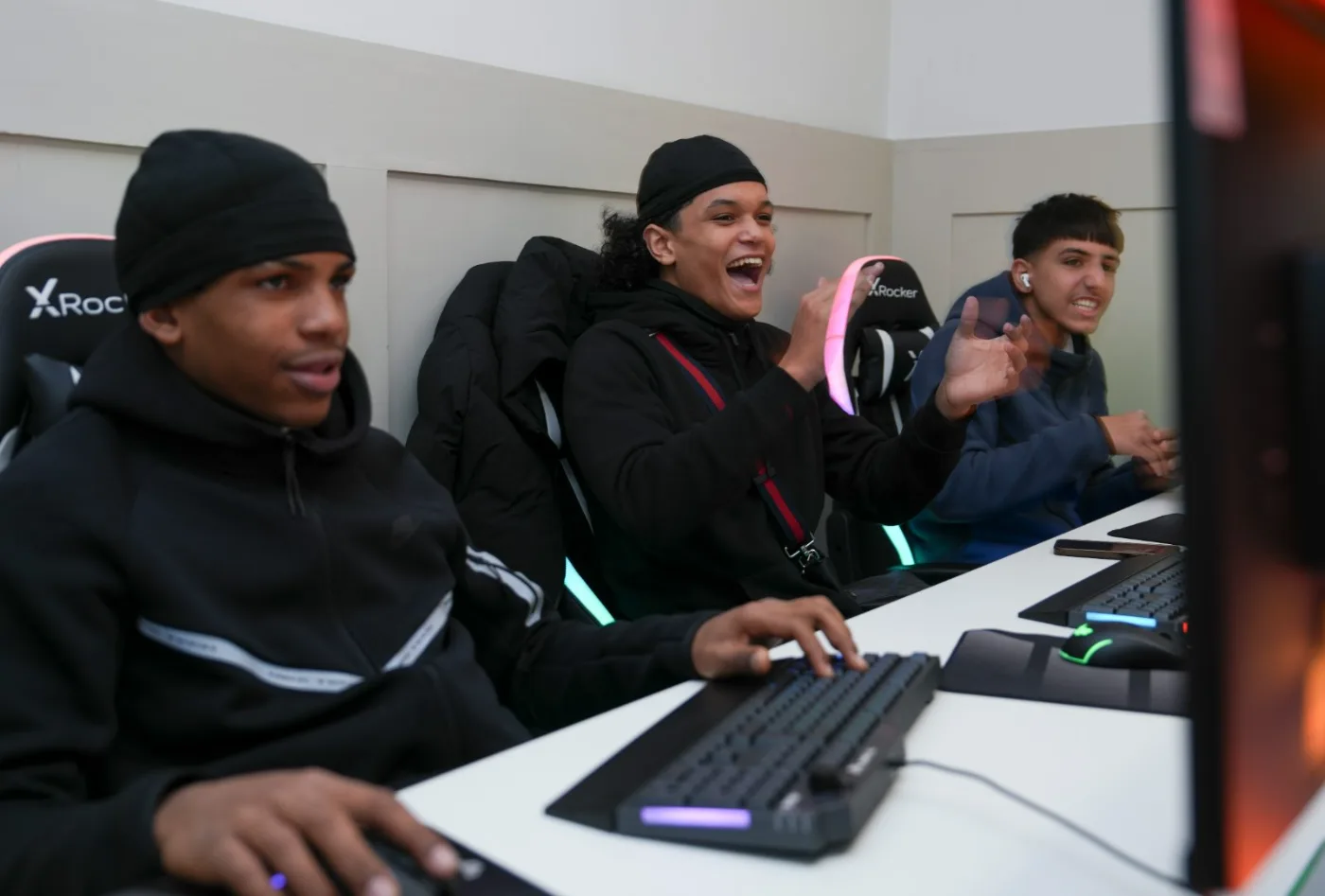 Young people at computers in the esports suite